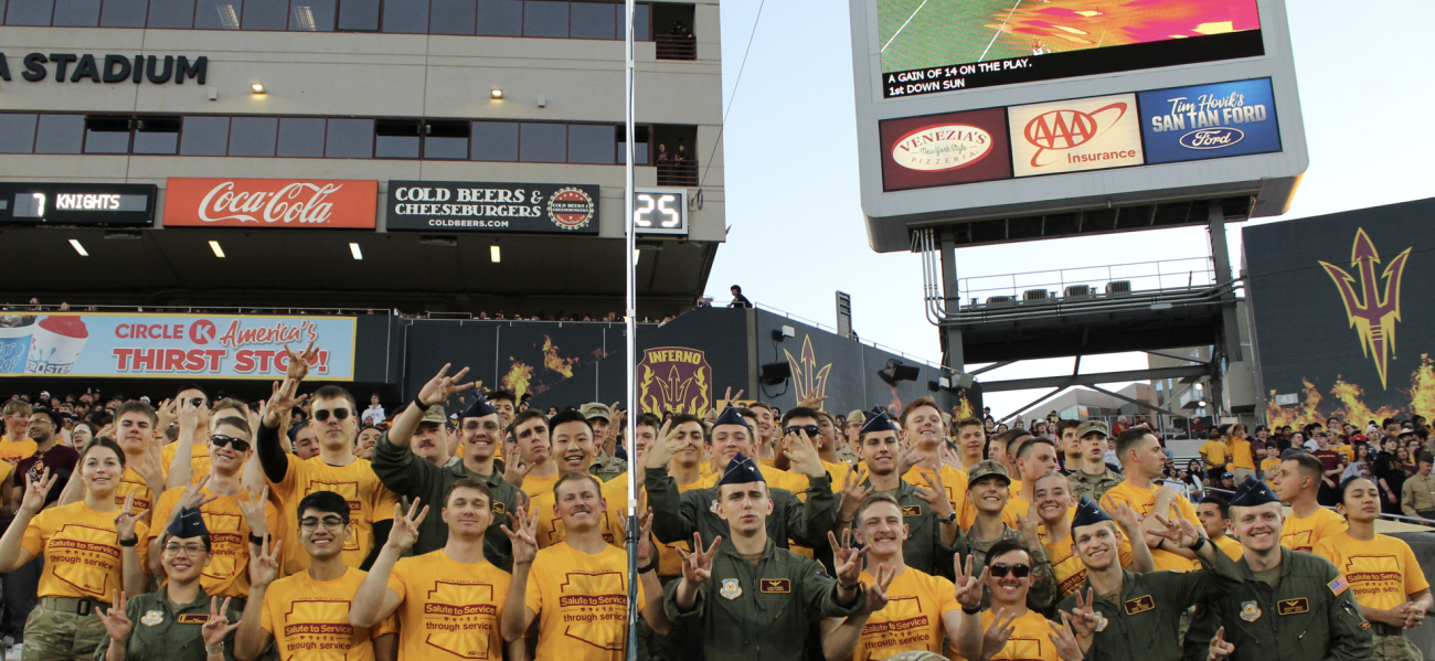 Two cadets salute. 